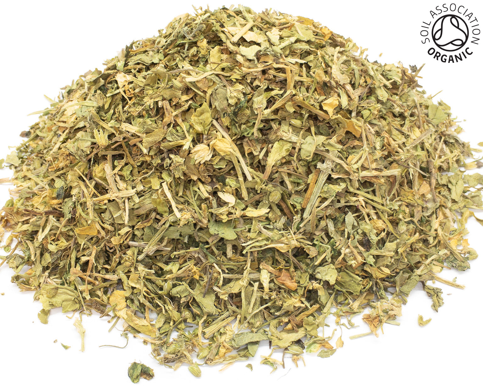 A small pile of dried, cut, organic chickweed herb on a white background with the Soil Association Organic Logo in the top right corner