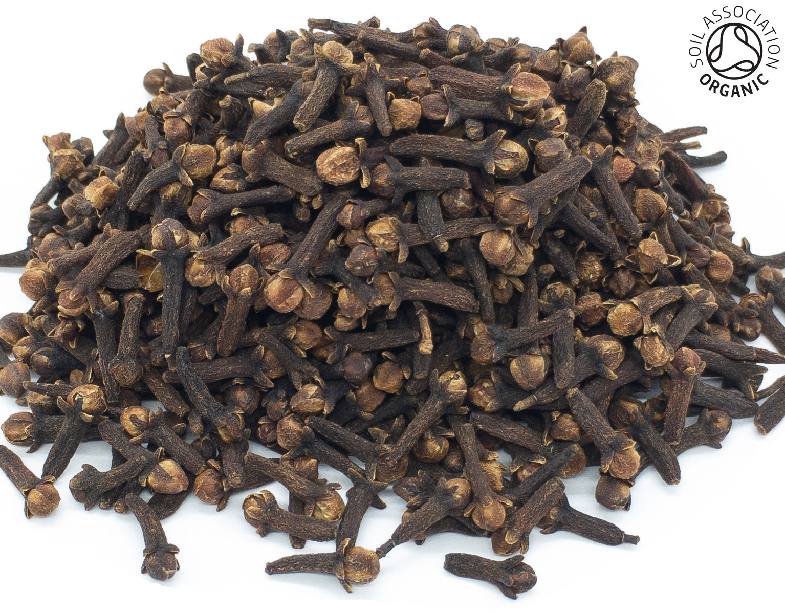 A small pile of dried, whole, organic clove buds on a white background with the Soil Association Organic Logo in the top right corner