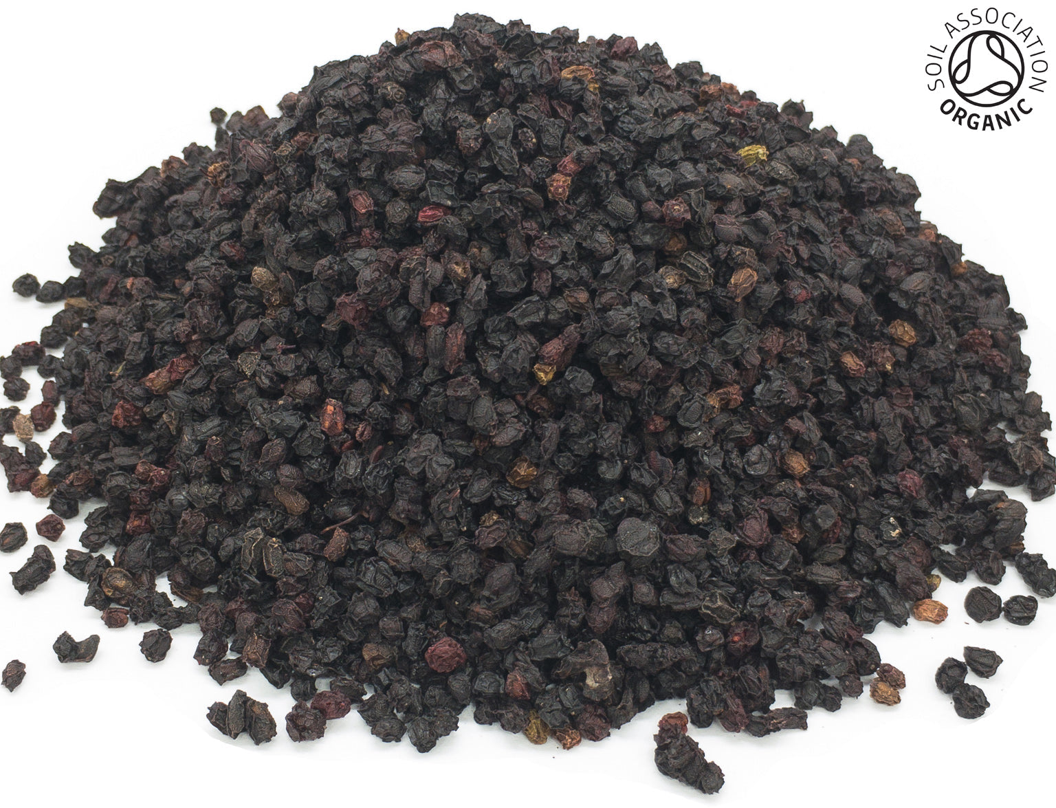 A small pile of dried, organic elderberries, on a white background with the Soil Association Organic Logo in the top right corner