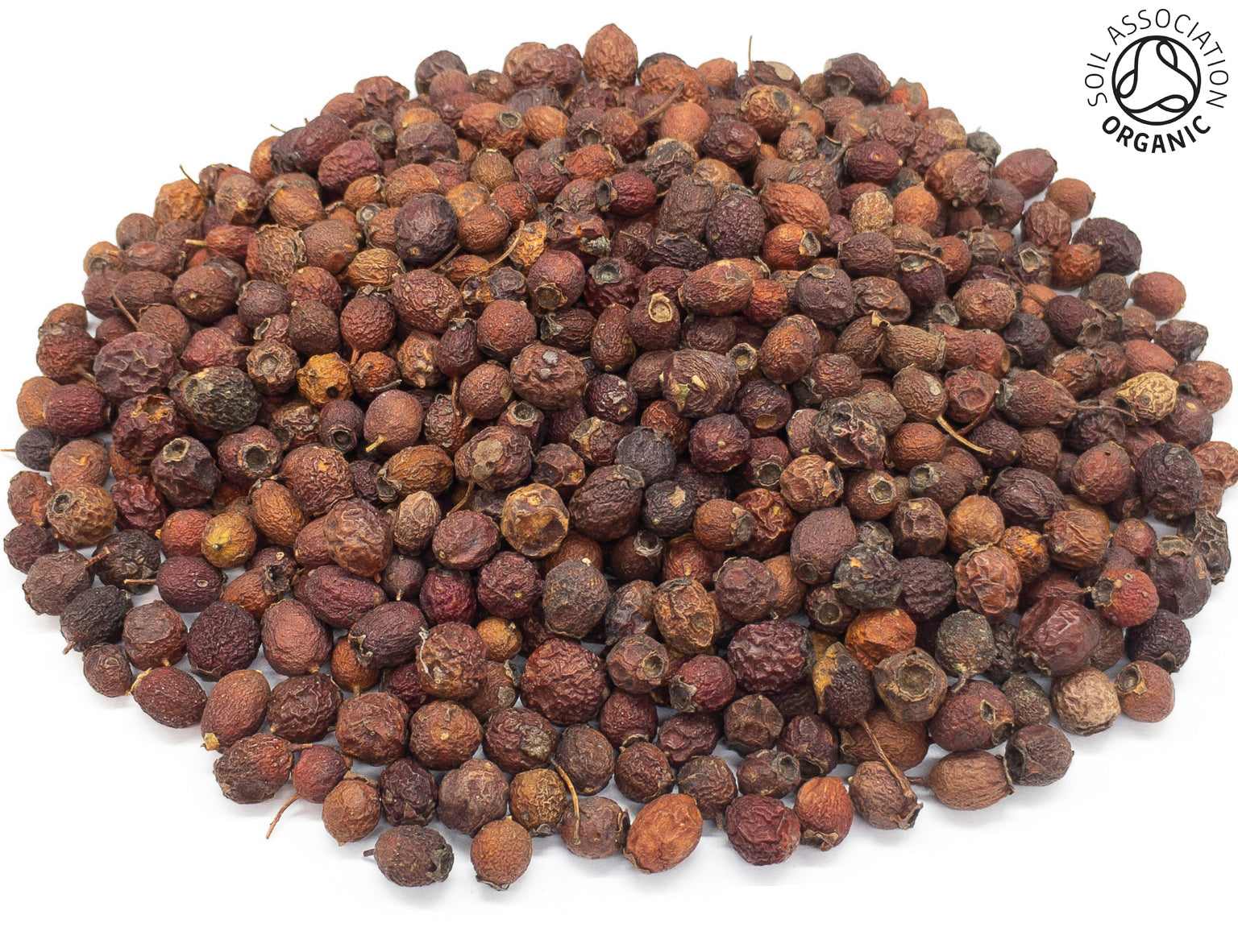 A small pile of dried, organic hawthorn berries, on a white background with the Soil Association Organic Logo in the top right corner