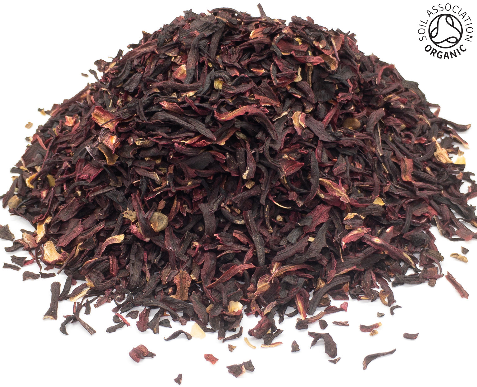 A small pile of dried, cut, organic hibiscus flower petals, on a white background with the Soil Association Organic Logo in the top right corner