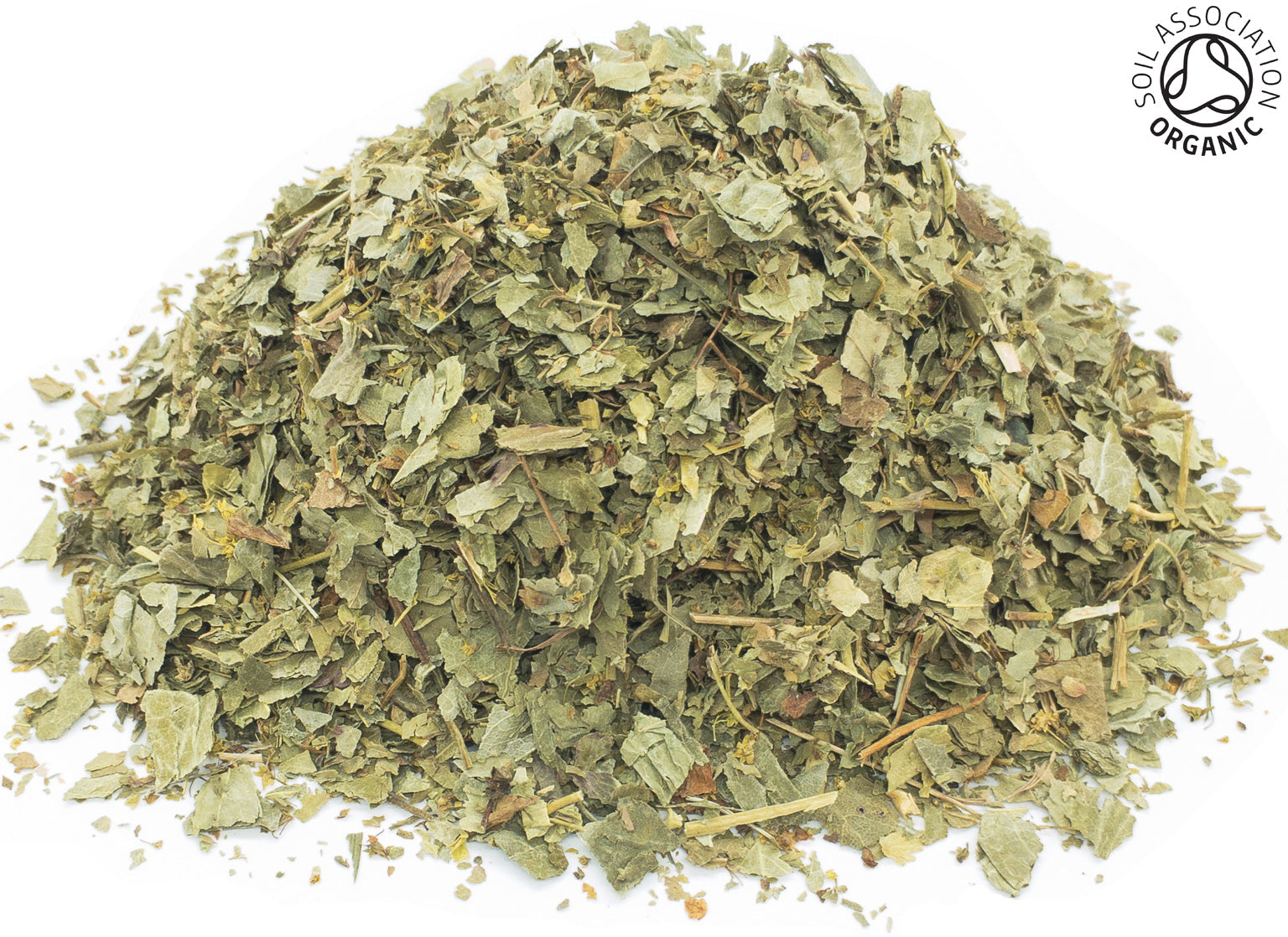 A small pile of dried, cut, organic green lady's mantle leaves on a white background with the Soil Association Organic Logo in the top right corner