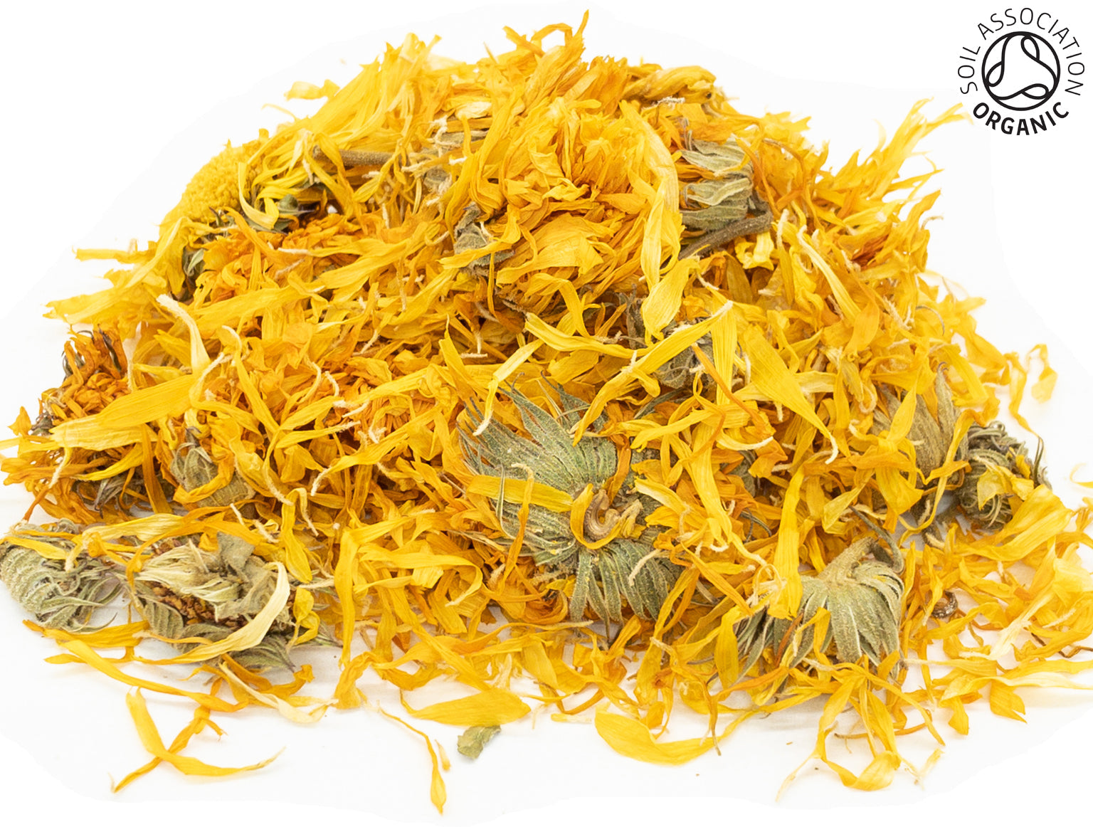 A small pile of dried, cut, organic yellow marigold flowers, petals and buds, on a white background with the Soil Association Organic Logo in the top right corner