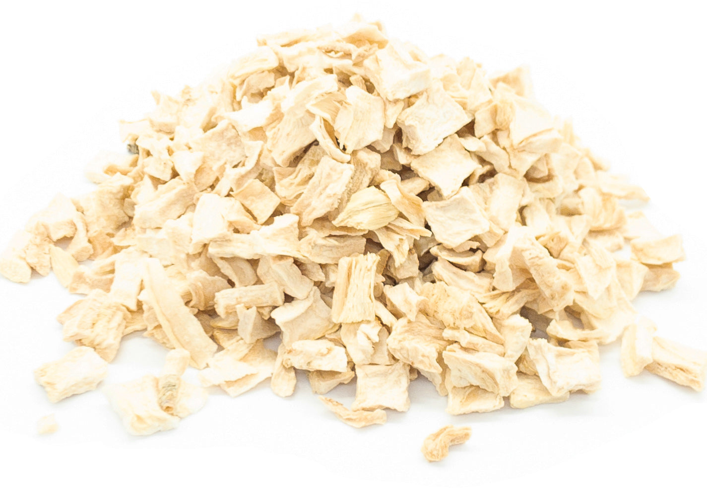 A small pile of dried, cut parsley root on a white background