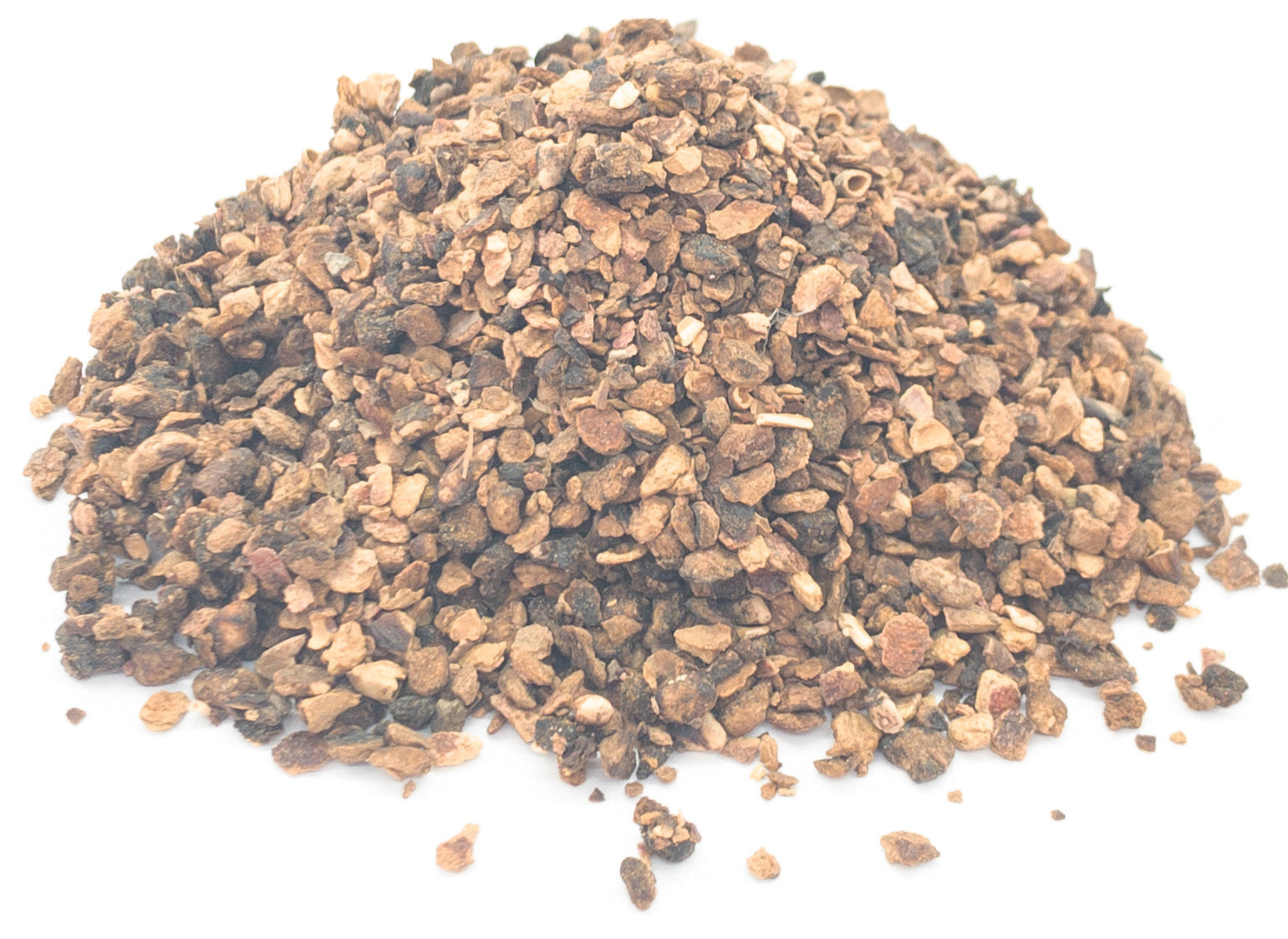 A small pile of dried, cut pomegranate peel on a white background