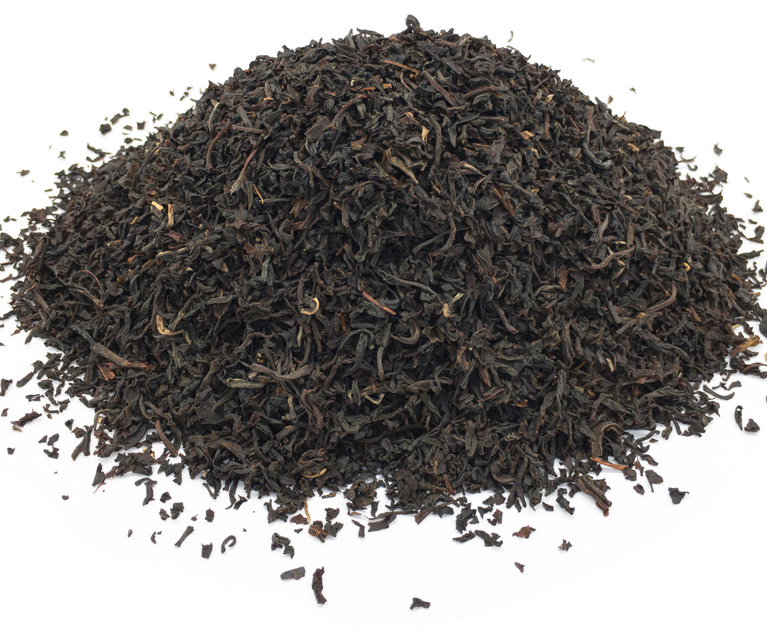 A small pile of dried, Scottish breakfast blend black tea leaves on a white background