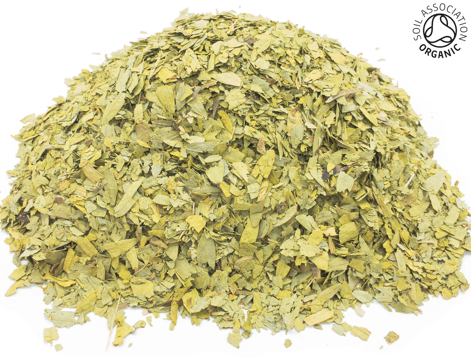 A small pile of dried, cut, green, organic senna leaves on a white background with the Soil Association Organic Logo in the top right corner
