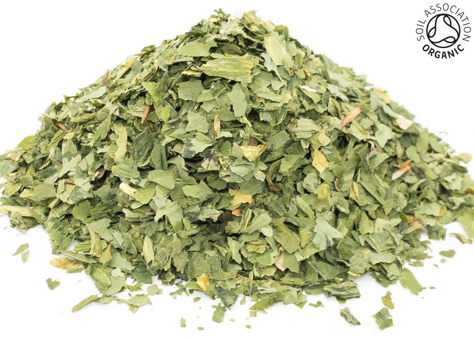A small pile of dried, cut, organic wild garlic herb leaves on a white background with the Soil Association Organic Logo in the top right corner