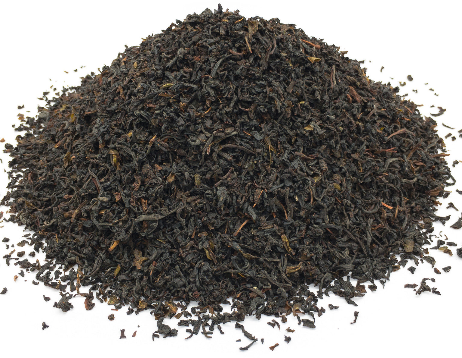 A small pile of ceylon black tea leaves on a white background