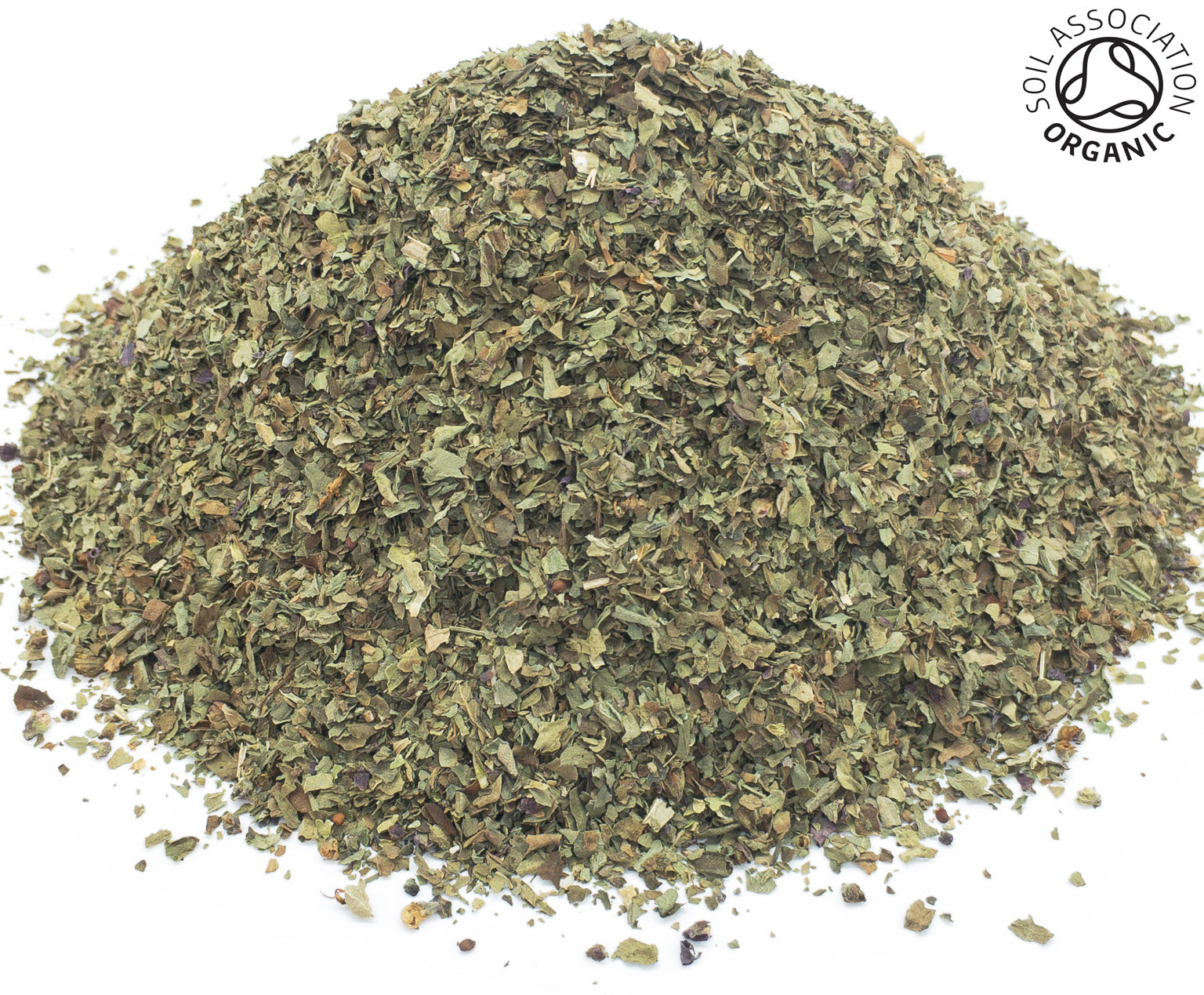 A small pile of dried, cut, organic basil leaves on a white background with the Soil Association Organic Logo in the top right corner