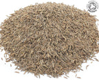 A small pile of dried, whole, organic caraway seeds on a white background with the Soil Association Organic Logo in the top right corner