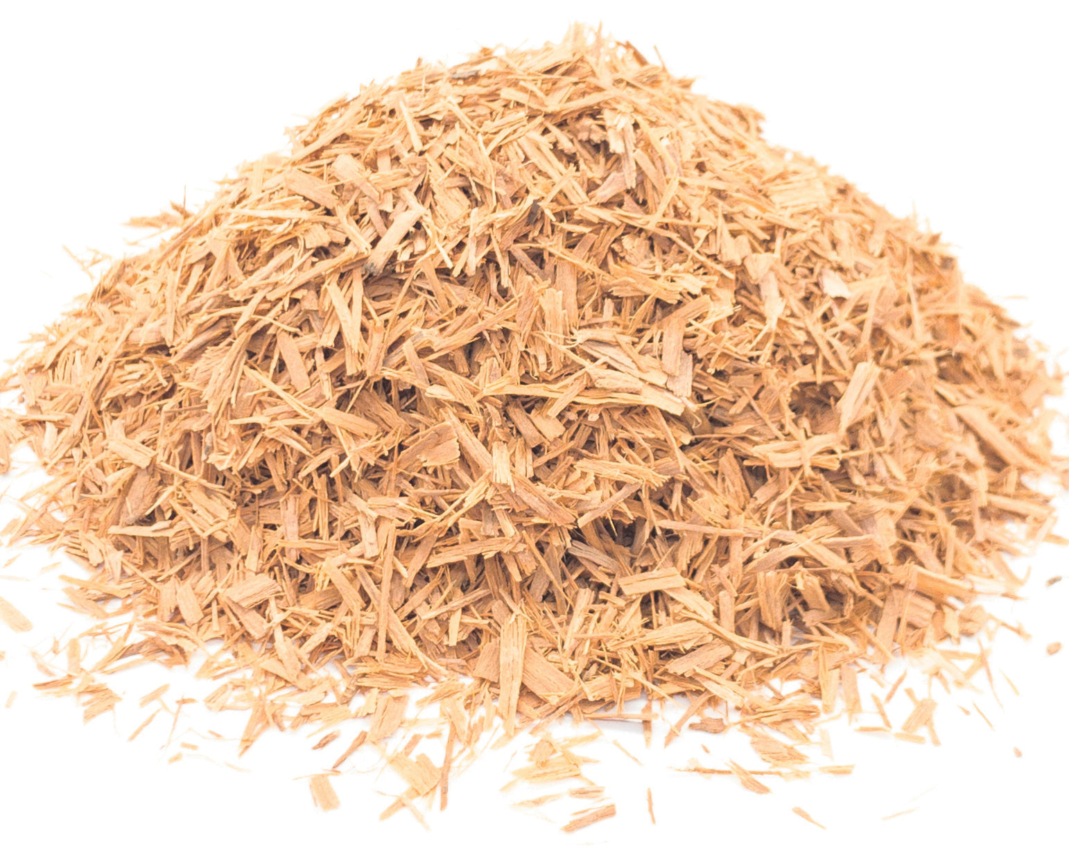A small pile of dried, cut cat's claw bark on a white background