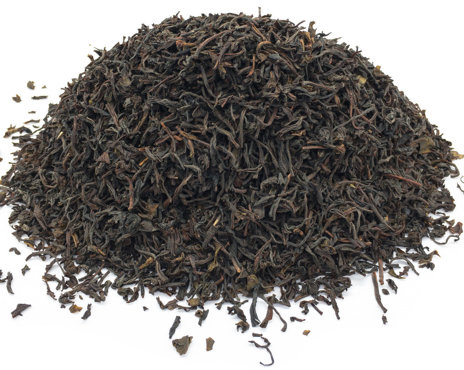 A small pile of dried Ceylon black tea leaves from the lover's leap tea garden in Sri Lanka, on a white background