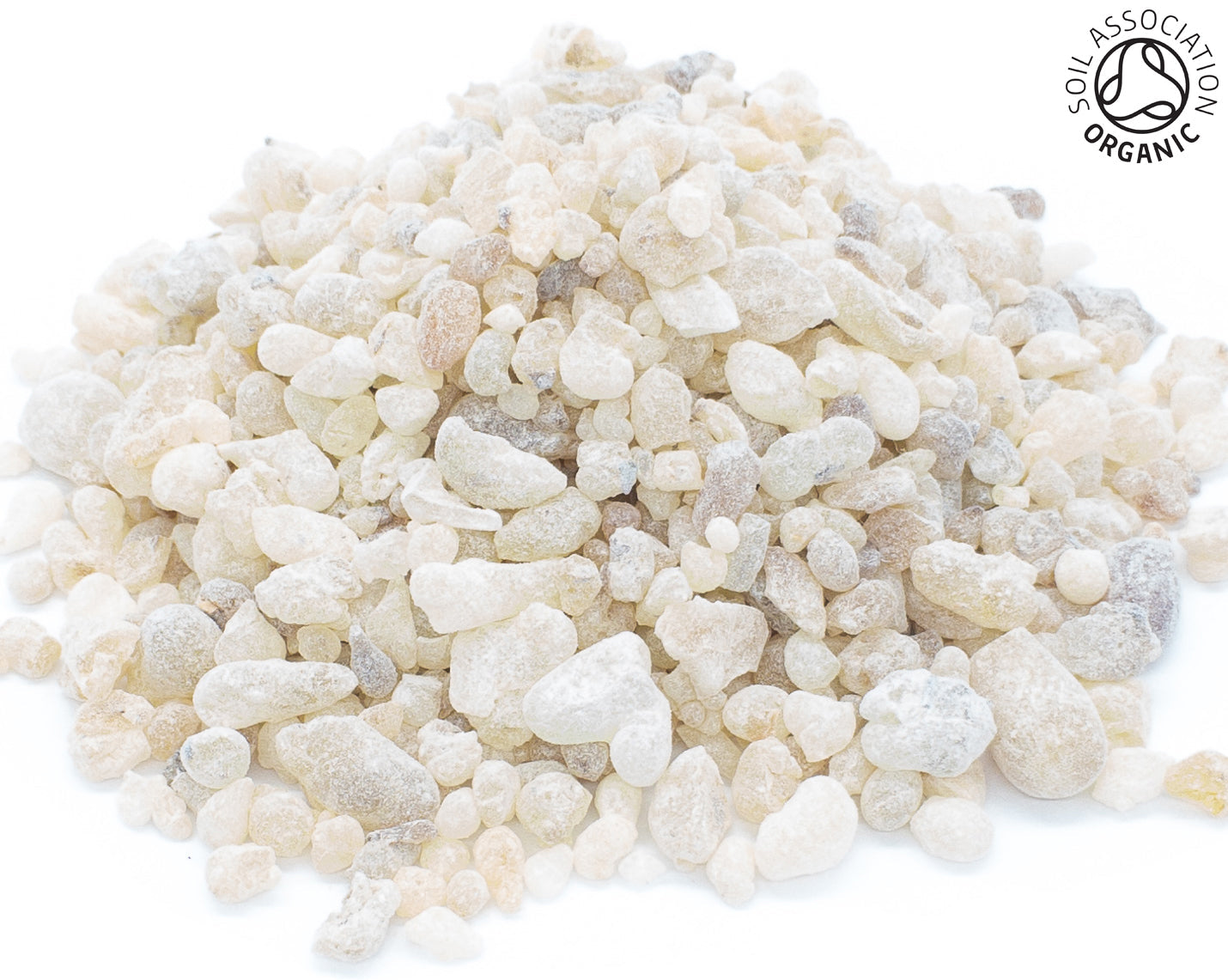 A small pile of organic frankincense resin on a white background with the Soil Association organic logo in the top right hand corner