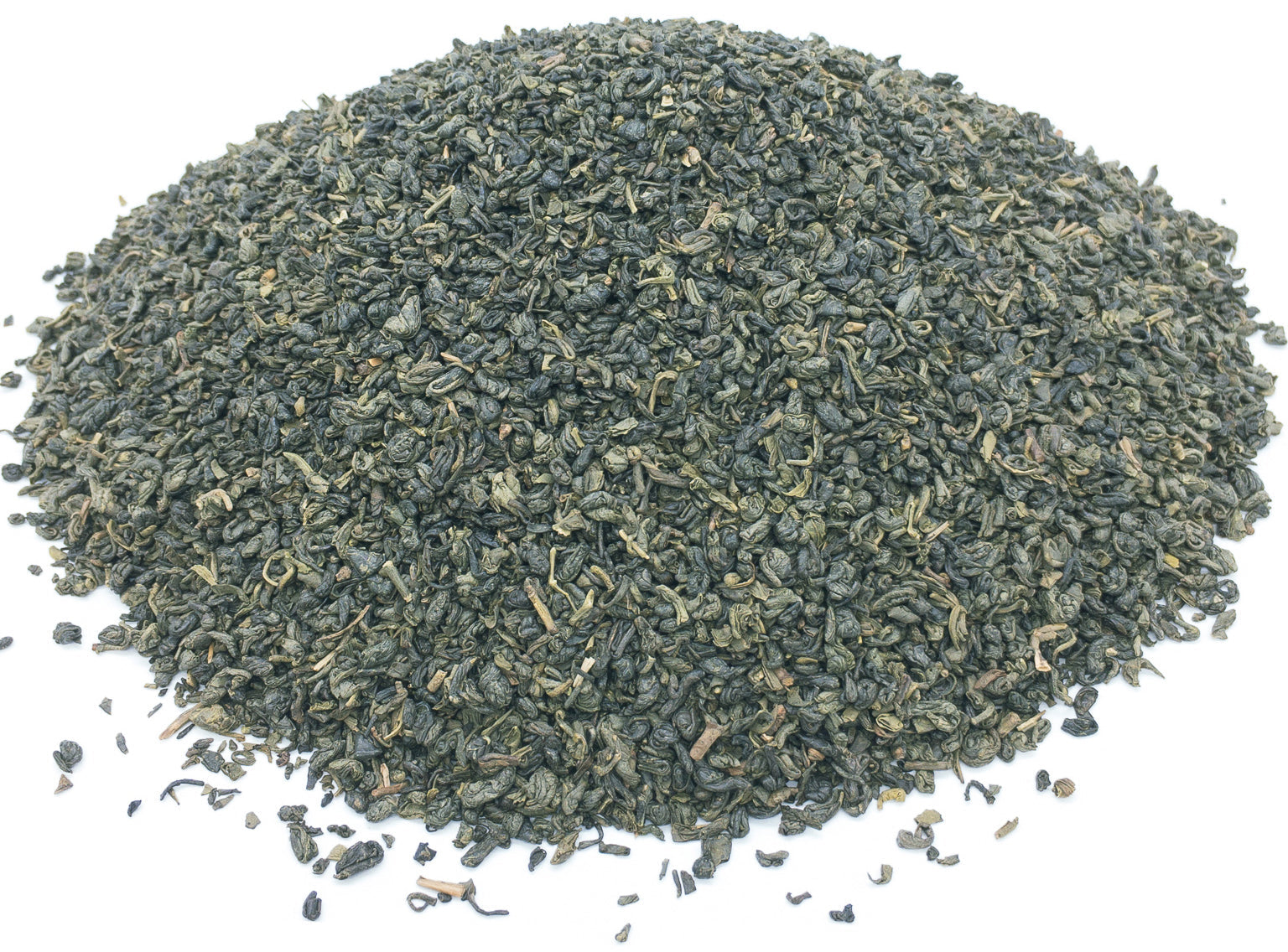 A small pile of dried gunpowder style green tea leaves on a white background