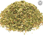 A small pile of dried, cut, organic hawthorn flowering top herb, on a white background with the Soil Association Organic Logo in the top right corner