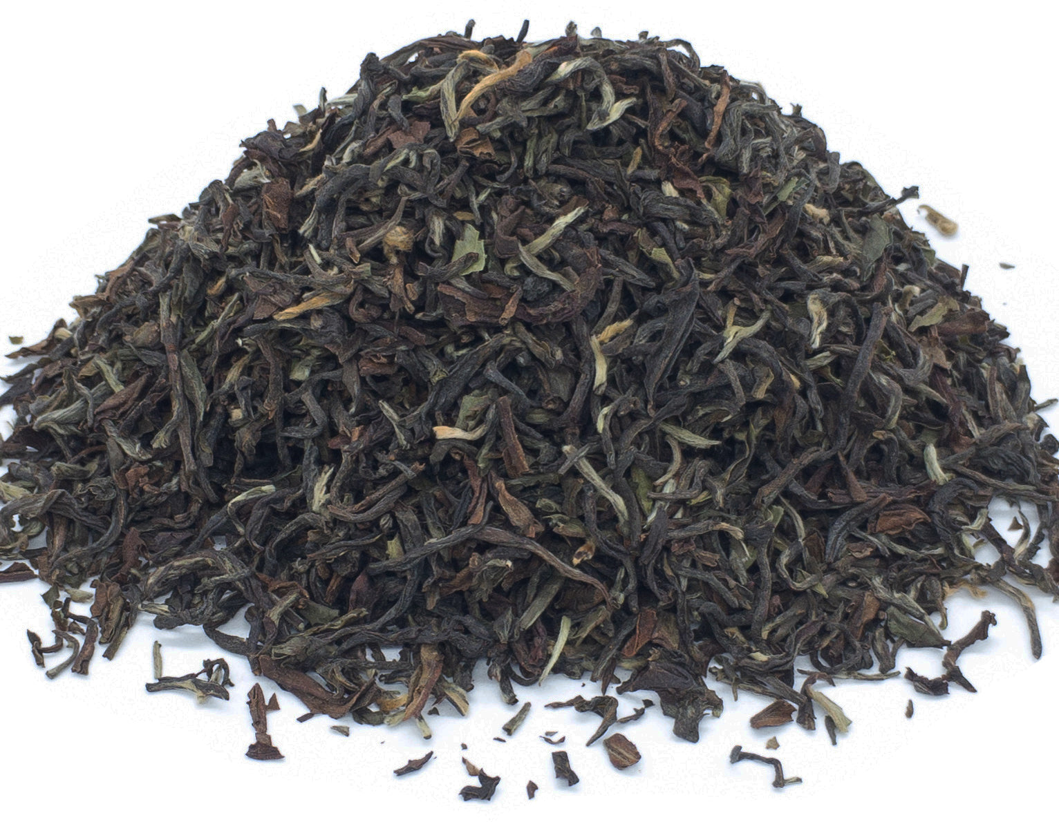 A small pile of dried, jun chiyabari TGFOP black tea leaves on a white background