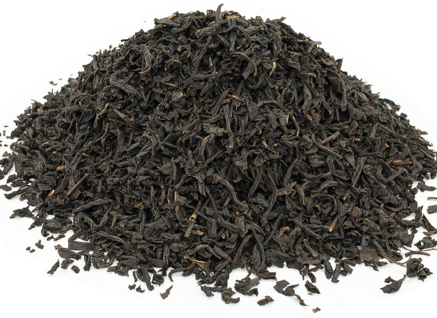 A small pile of dried, lapsang souchong black tea leaves on a white background