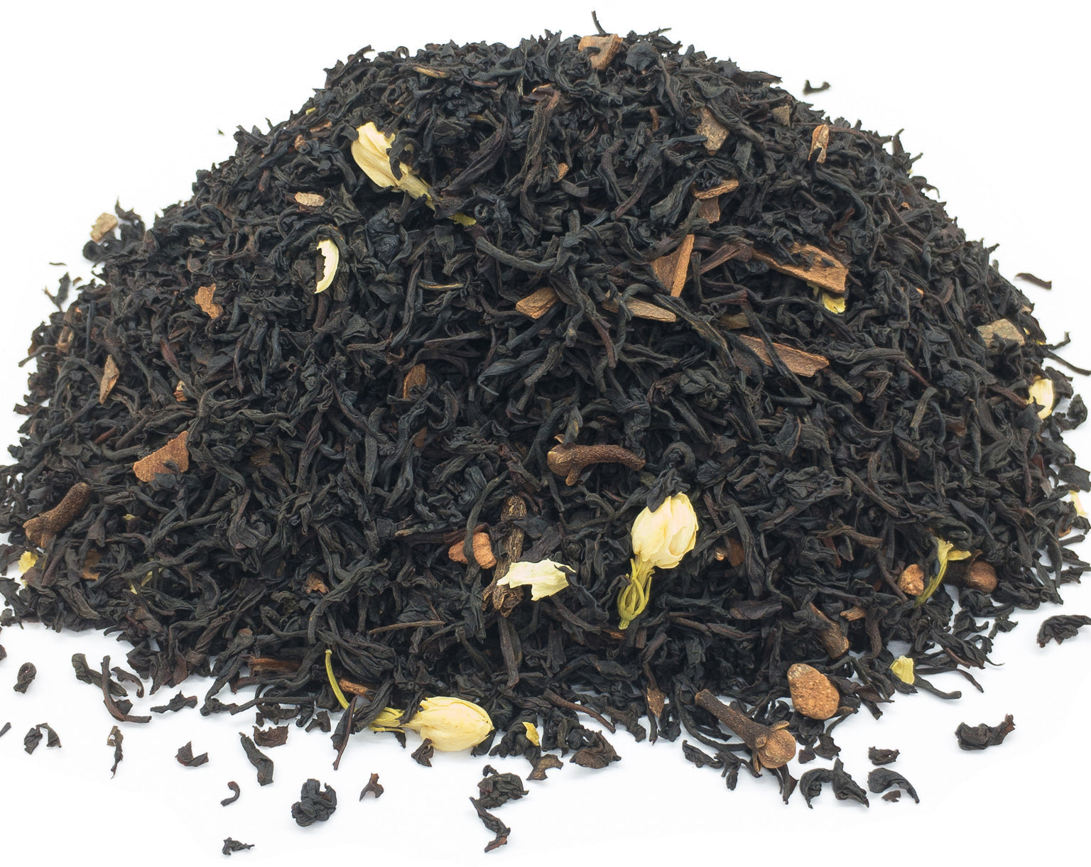 A small pile of dried, mulled spice blend herbal tea on a white background