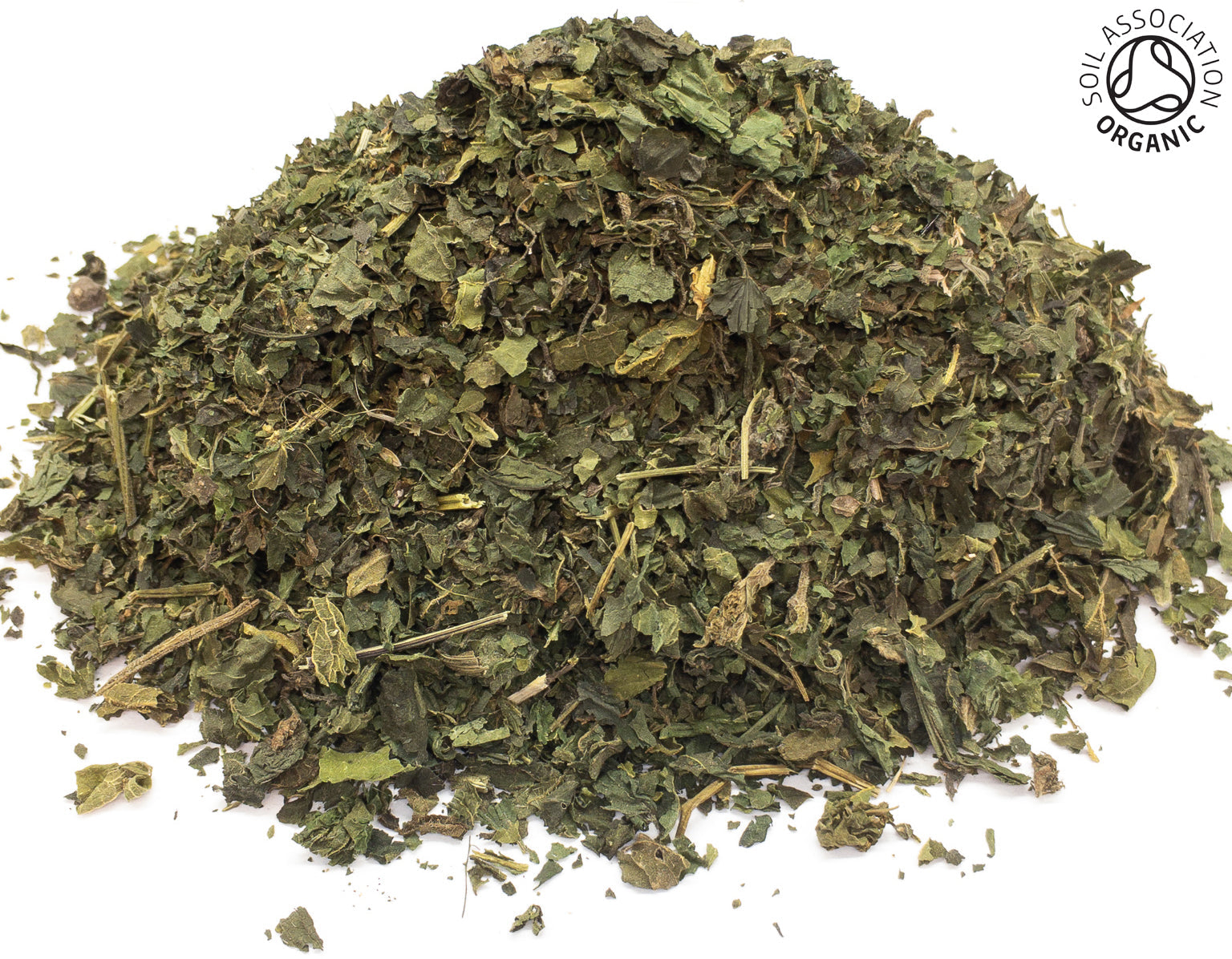 Small pile of dried, cut, organic green stinging nettle leaves on a white background with the Soil Association Organic Logo in the top right corner