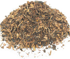 A small pile of dried, cut sarsaparilla root on a white background