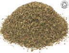 A small pile of dried, cut organic green spearmint leaves on a white background with the Soil Association Organic Logo in the top right corner