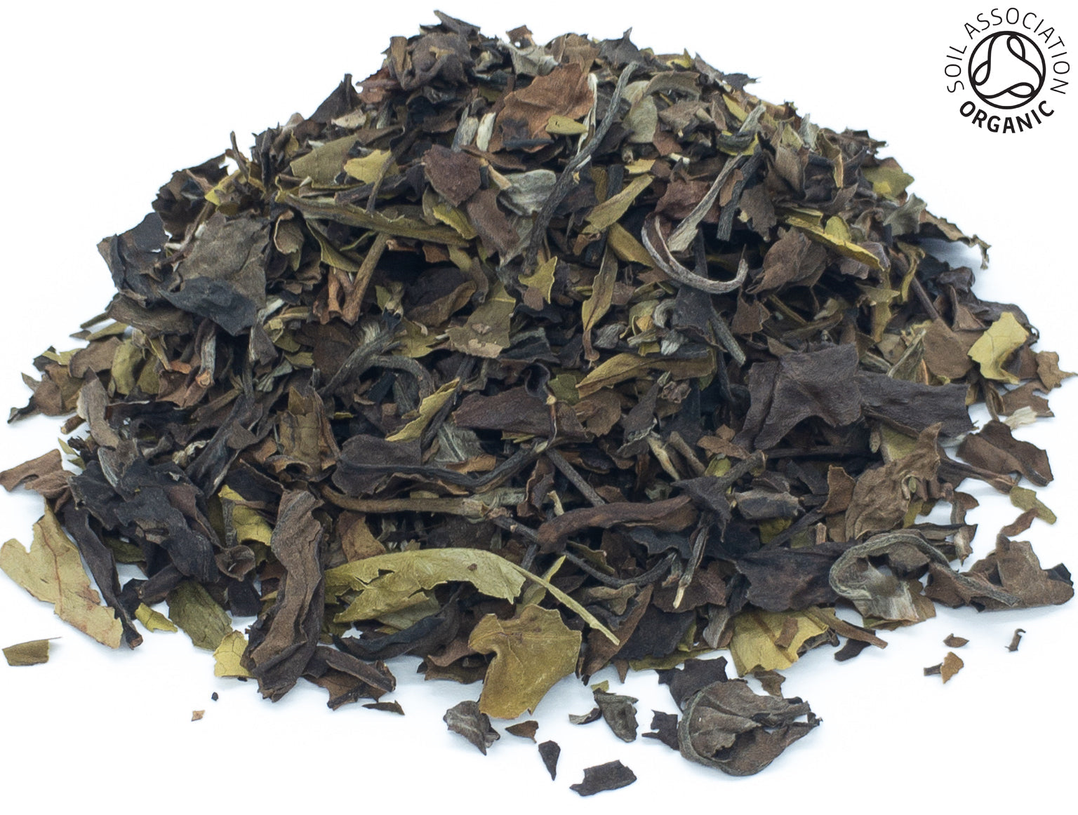 A small pile of dried, organic, white peony white tea leaves on a white background, with the Soil Association organic logo in the top right hand corner