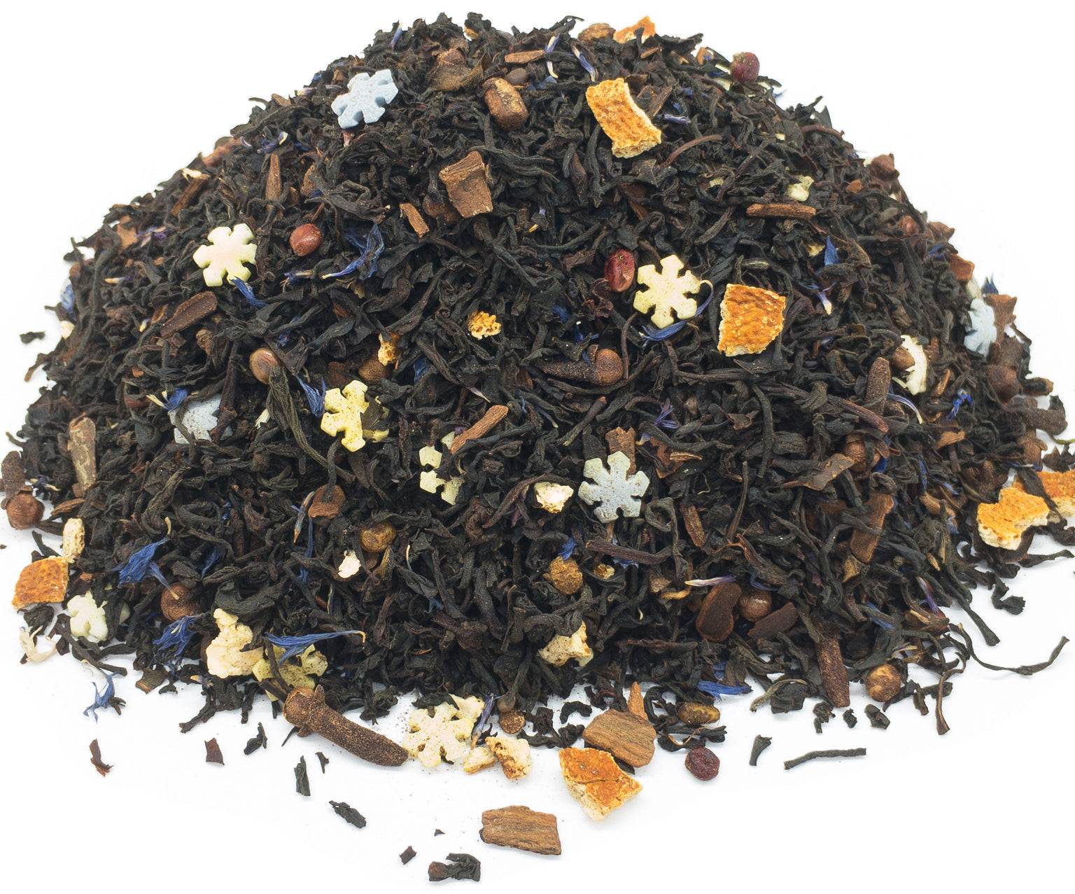 A small pile of dried, winter earl grey blend herbal black tea on a white background
