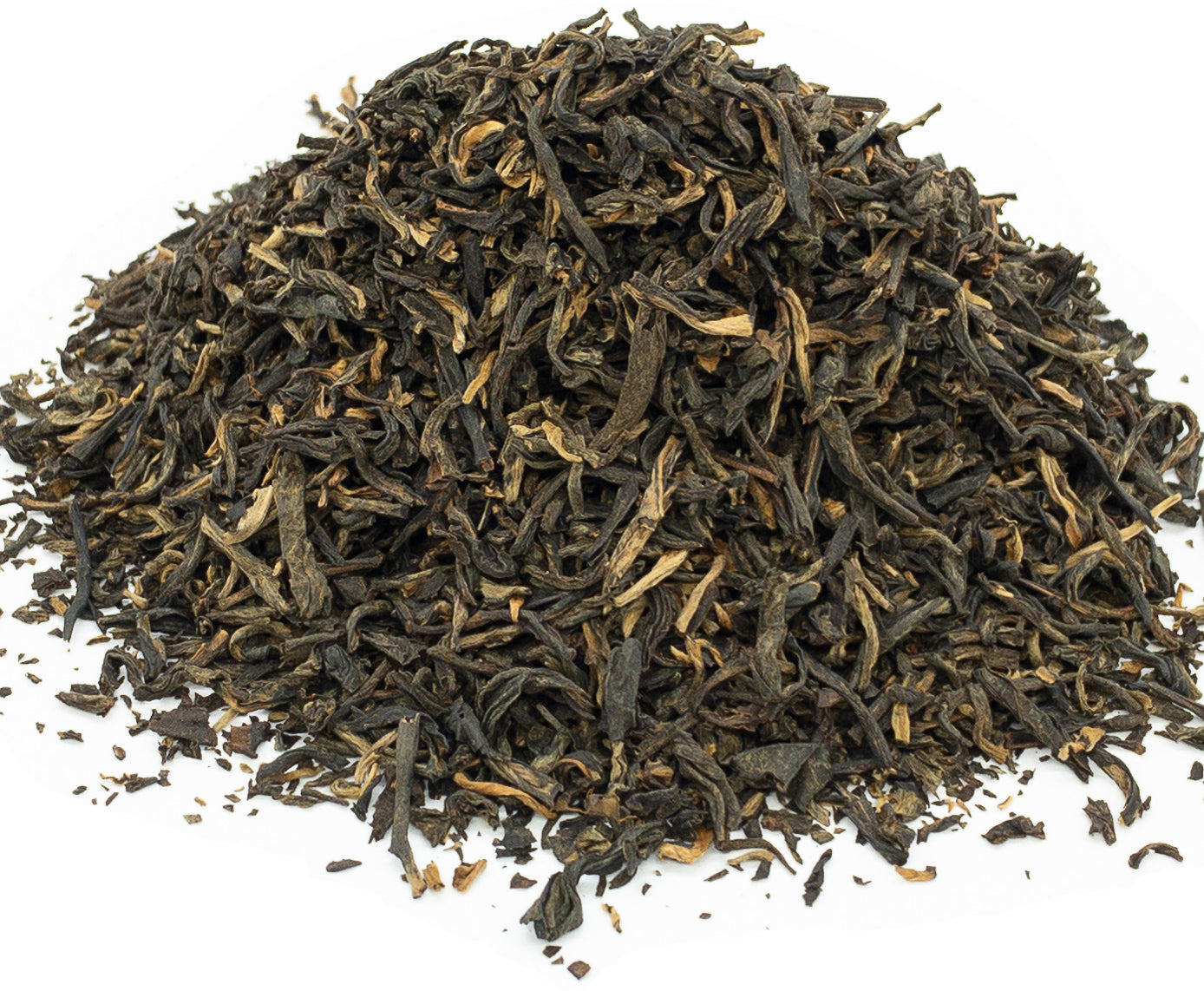 A small pile of dried, yunnan black tea leaves on a white background